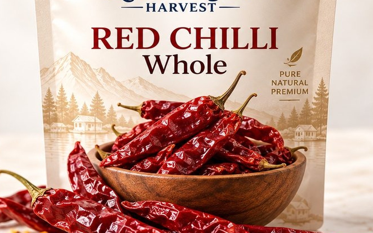 Whole dried red chilli pods through package window angle