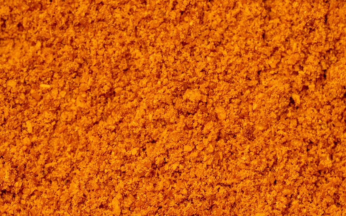 Stone ground pure red chilli powder in bowl 45 degree angle